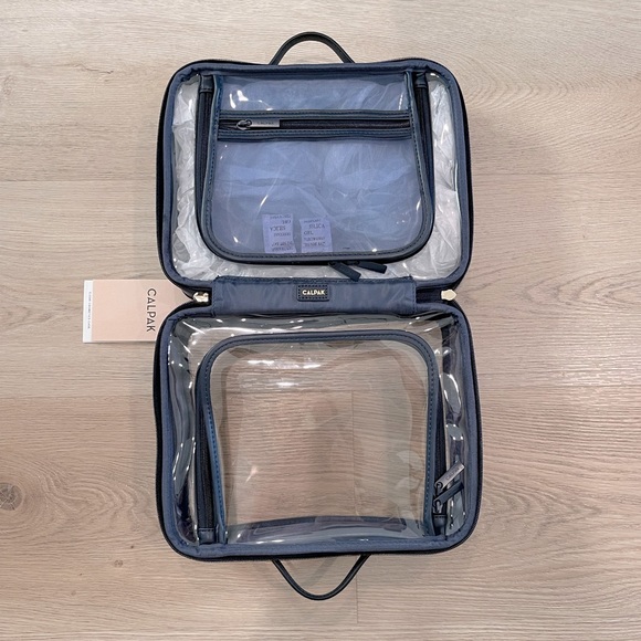 Calpak Handbags - NWT Calpak Large Clear Cosmetics Case.